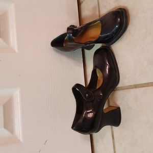 Black leather upper shoes, strap goes across top